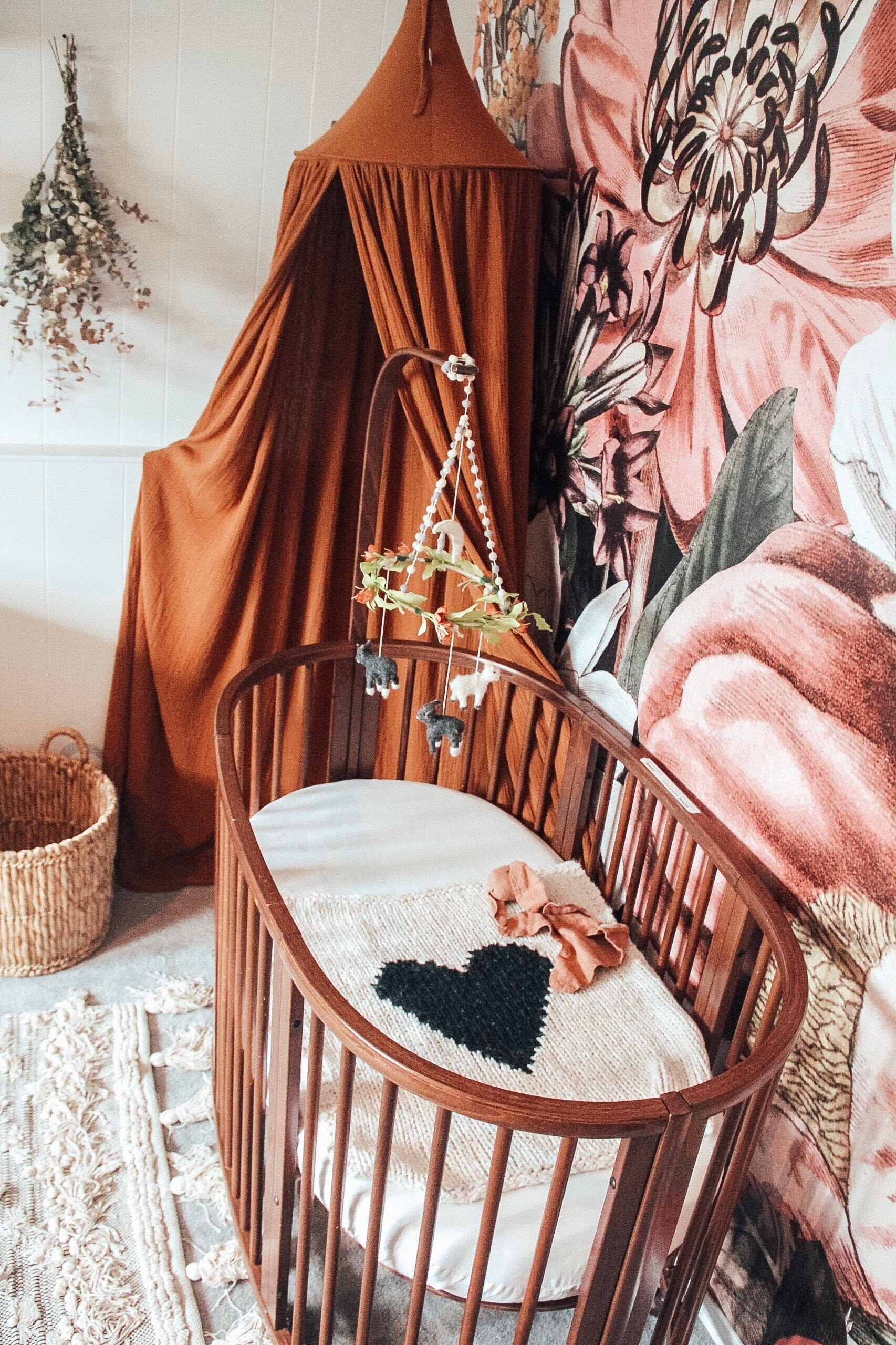 A Garden-Themed Nursery Featuring a Floral Wall Mural