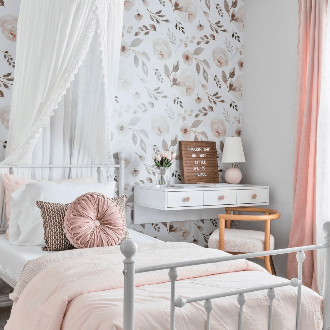 Patterned wallpaper and blind in teenager girls bedroom with white