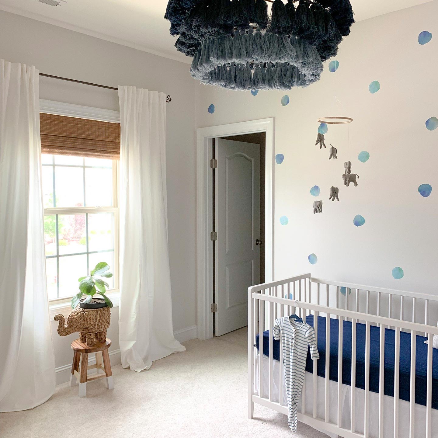 Nursery with blue watercolor polka dot wall decals