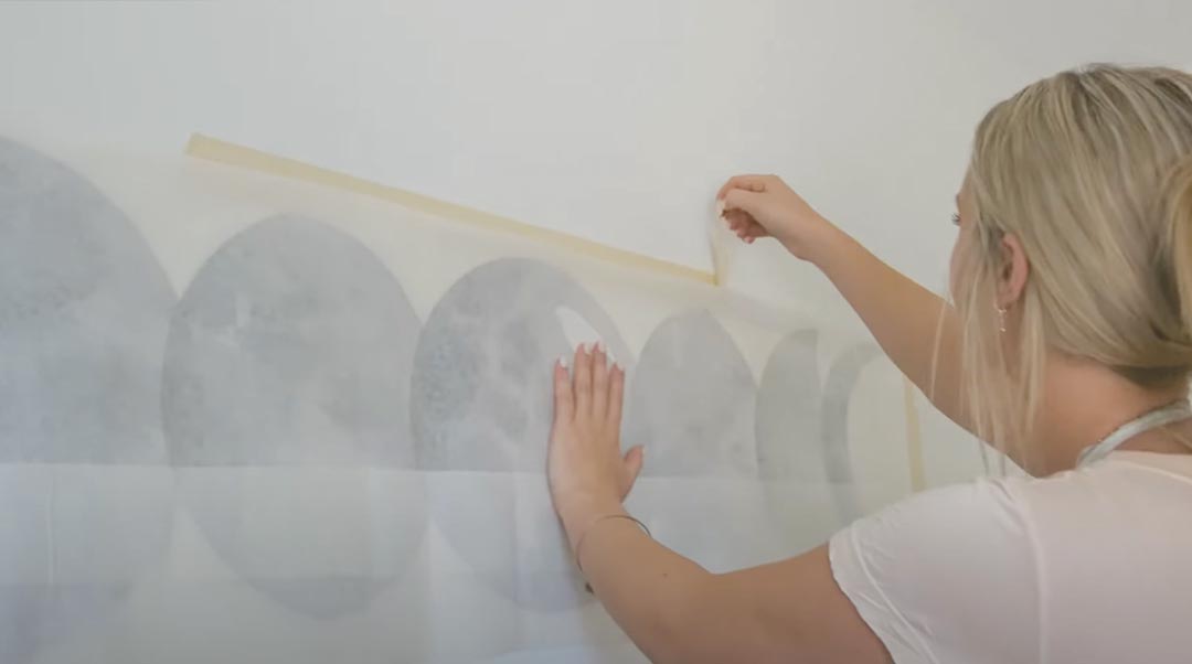 Load video: Watch how to install a larger-sized decal allowing you to easily create a stunning focal point on any wall or smooth surface.  See our step-by-step installation process and get insider tips and how to install our new product! Available in two colors Slate and Quartz, our moon wall decals have a soft watercolored appearance, providing an artistic aesthetic. Stay wild, moon child.