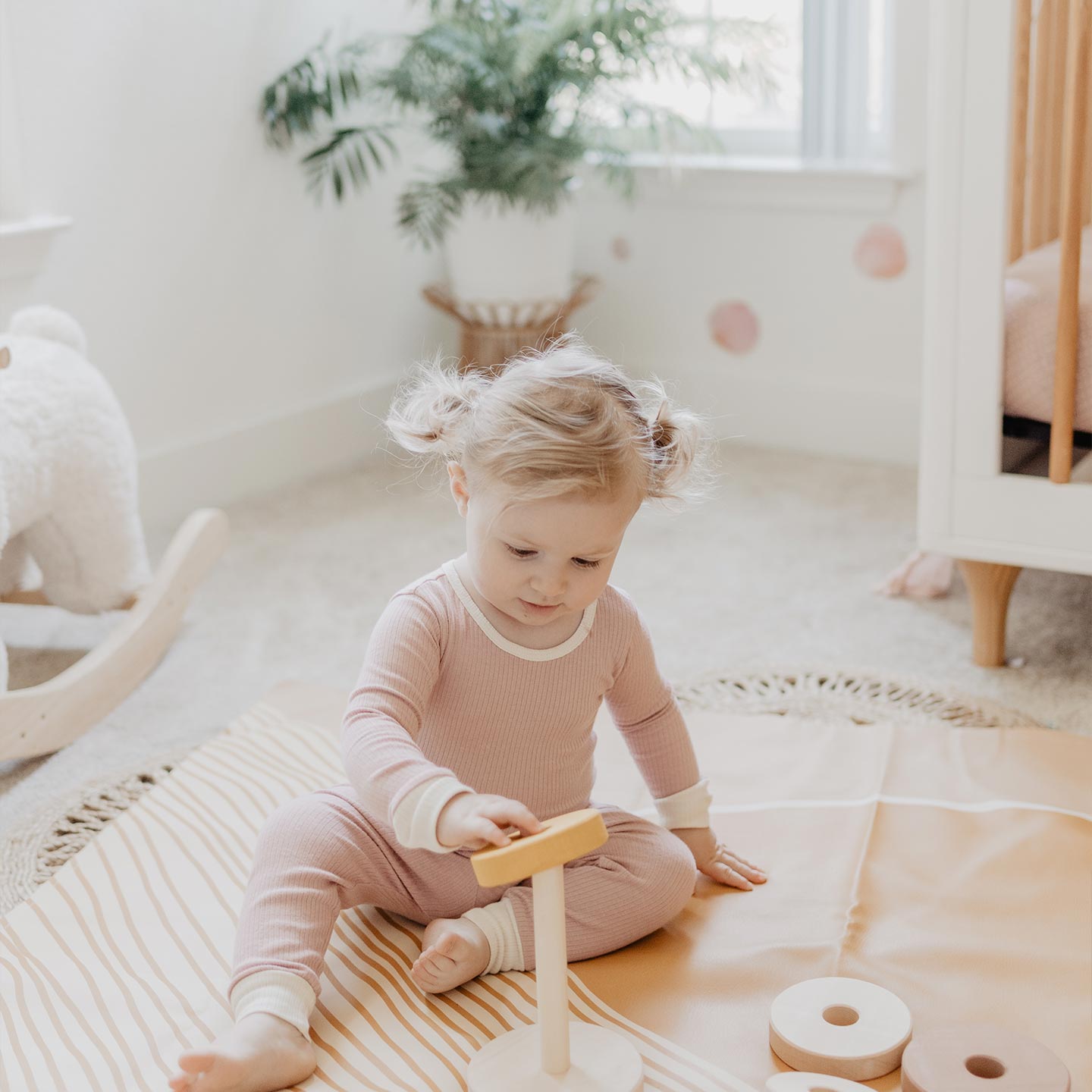 Room with soft pink watercolor polka dot decals